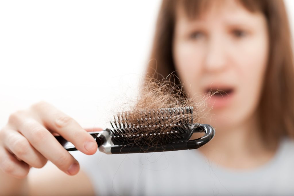 woman suffering from hair loss